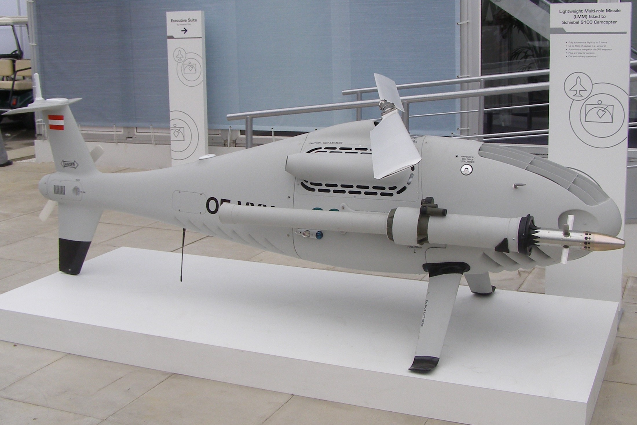 A Schiebel CAMCOPTER S-100 fitted with a Lightweight Multirole Missile By MilborneOne - Own work, CC BY-SA 3.0, https://commons.wikimedia.org/w/index.php?curid=4390358